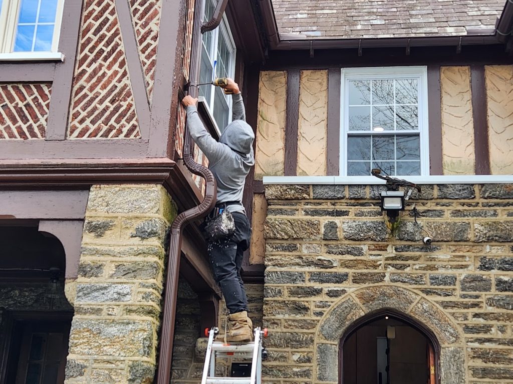 Gutter repair on a stone home