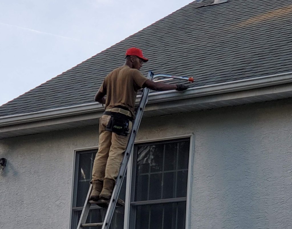 Handi Boyz crew installing gutter guards