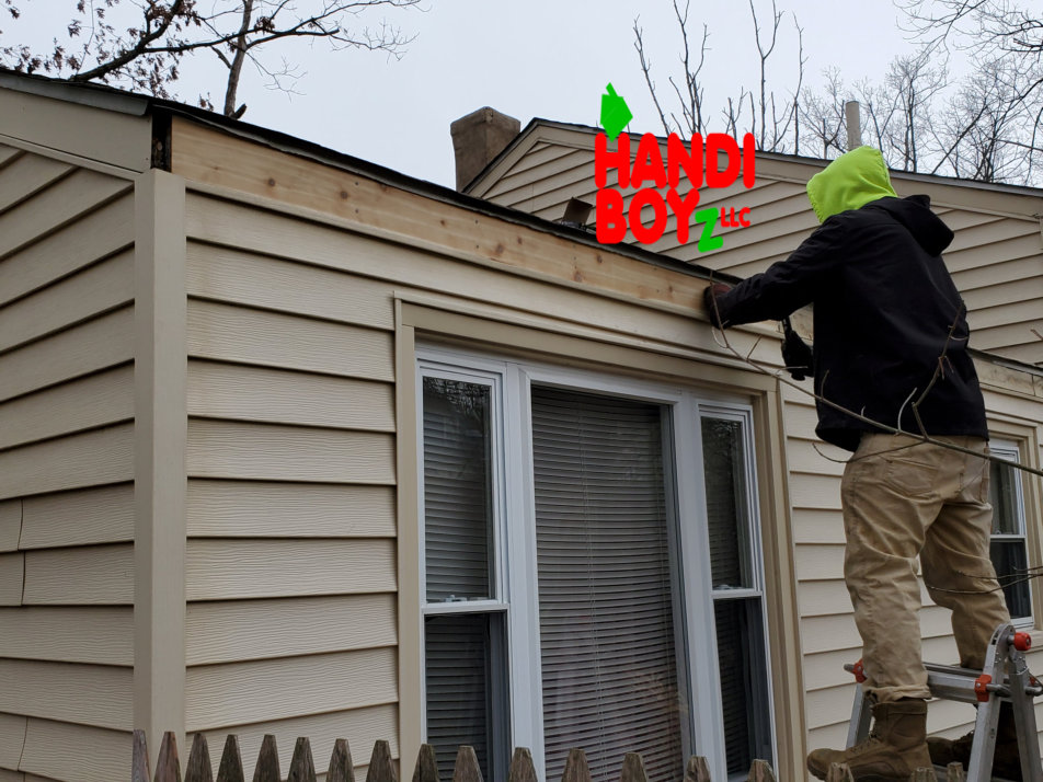 Handi Boyz installer fitting LeafBlaster Pro gutter guards